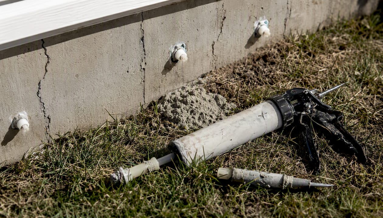 Foundation crack repair tools on concrete