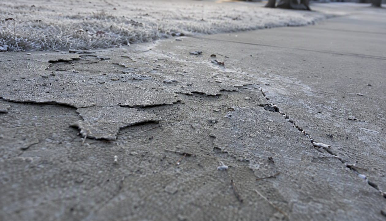 Close-up of freeze-thaw damaged concrete surface