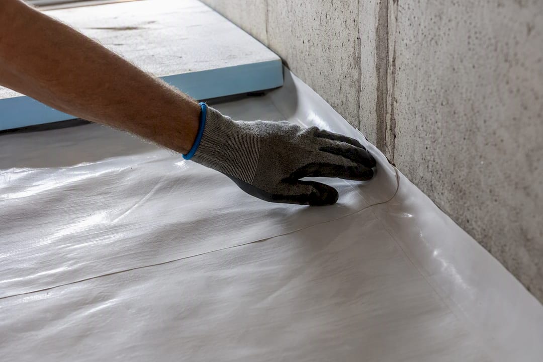 Hand checking crawl space vapor barrier seam