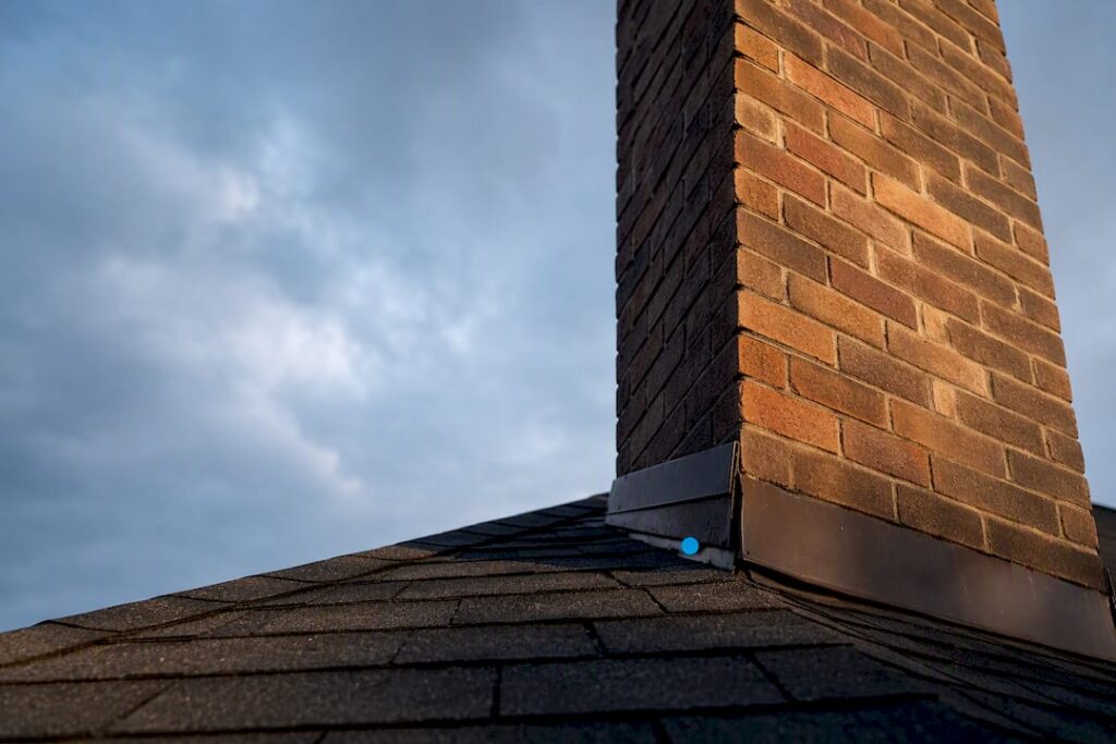 Masonry chimney separating from roofline